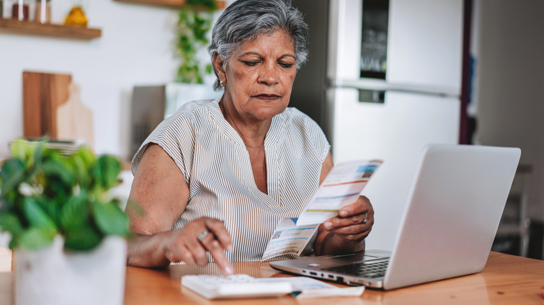 senior looking at her finances