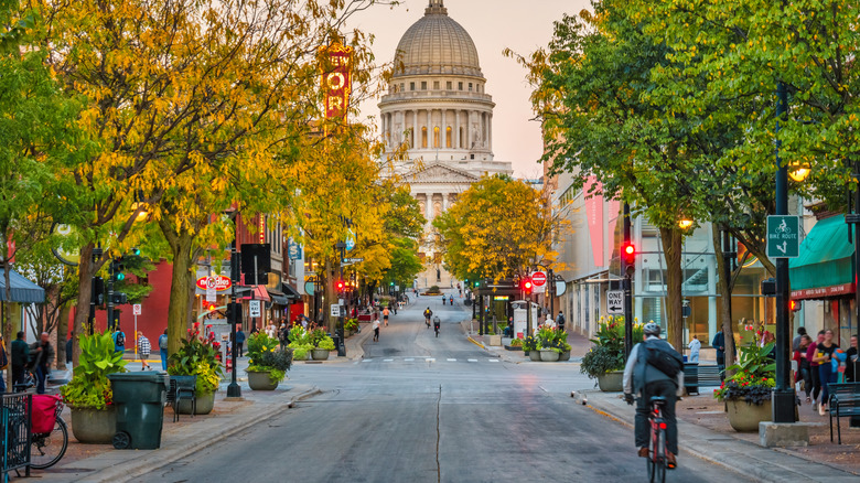 Shot of people walking and riding bikes in street in Madison, Wisconsin