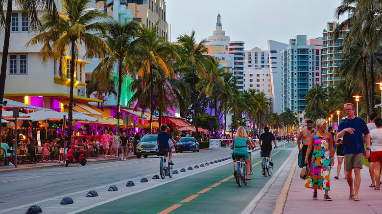 People walking in Miami Beach in the early evening