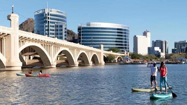 People paddling on river near bridge in Tempe Arizona