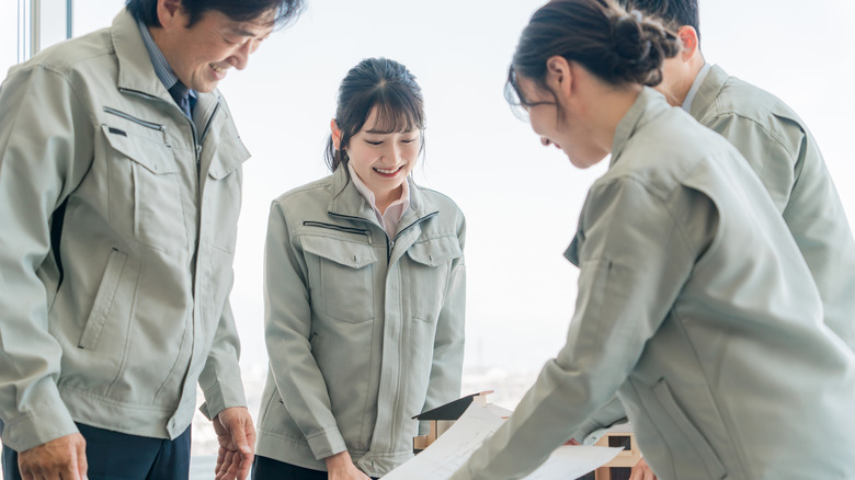 workers looking at plans