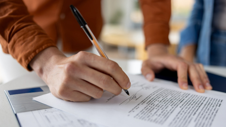 Person signing a mortgage deed