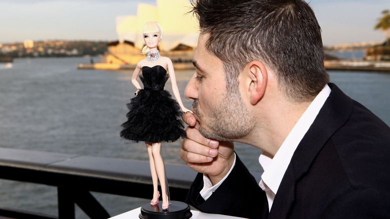 Stefano Canturi kissing Barbie doll hand