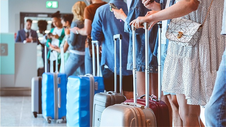 Line of people with luggage