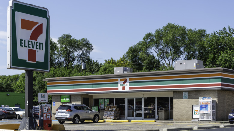 7-Eleven sign with store in the distance