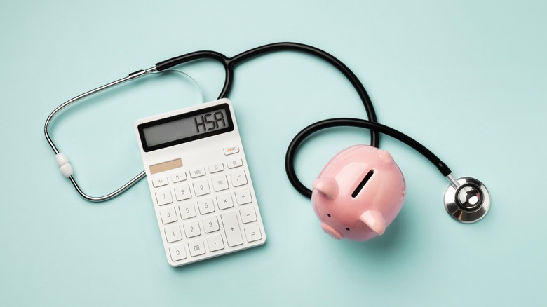 Image of a calculator, piggy bank, and stethoscope.