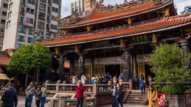 Longshan Temple in Taipei, Taiwan with visitors in front