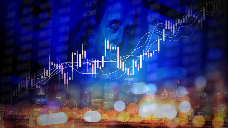 stock market chart and $100 bill in background