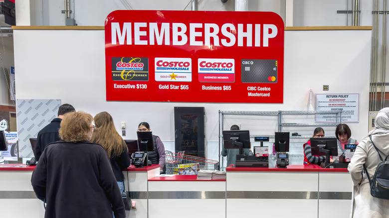 Customers in line at Costco's membership desk