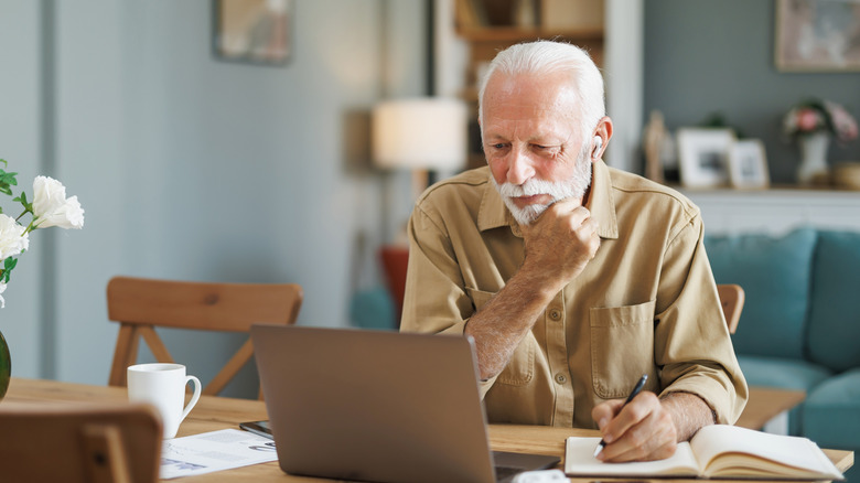 senior man working at a laptop