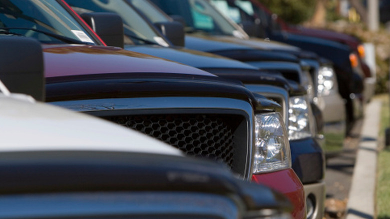 Close-up of a row of pickup trucks