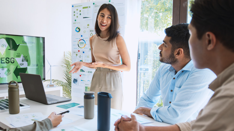 Young person presenting at a work meeting