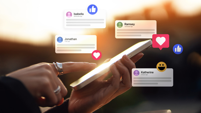 A person receiving notifications and commenting on social media posts with smart phone.
