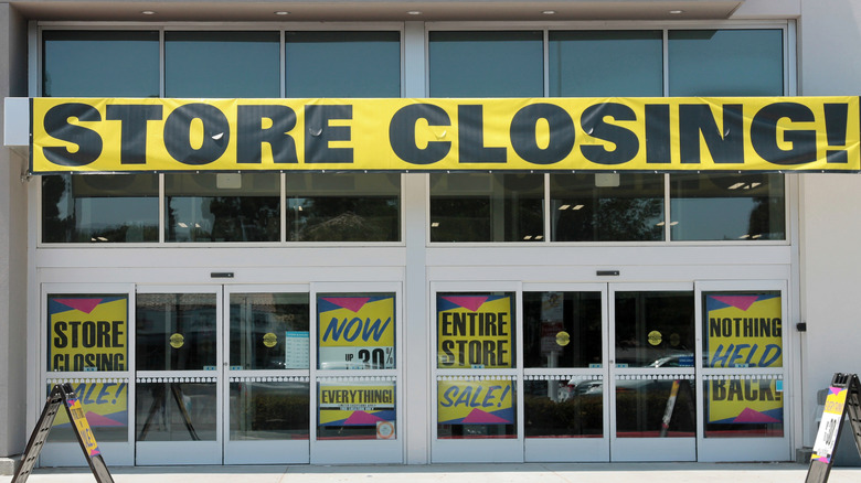 A Store Closing! sign in front of a building