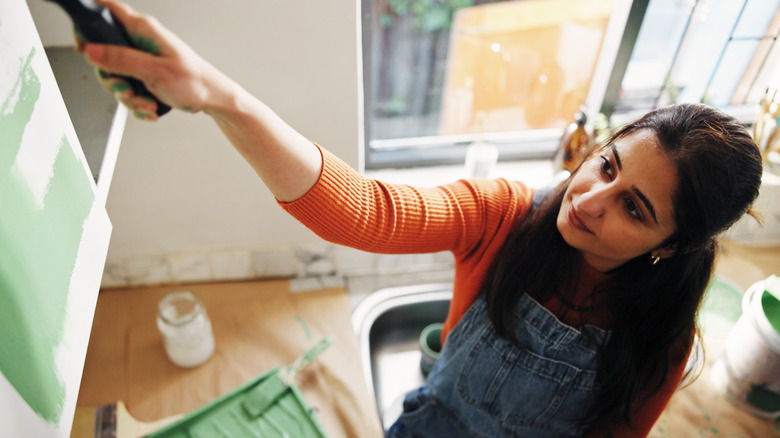 young woman renovating her kitchen