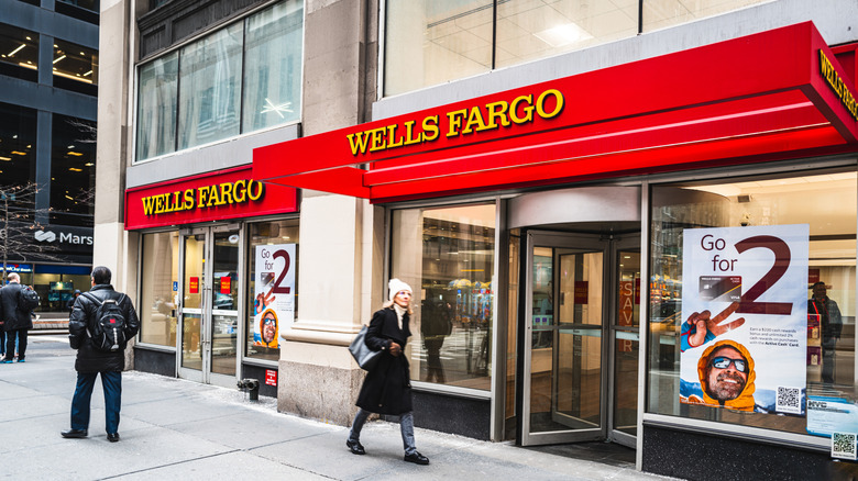 Pedestrians passing a Wells Fargo bank branch in New York