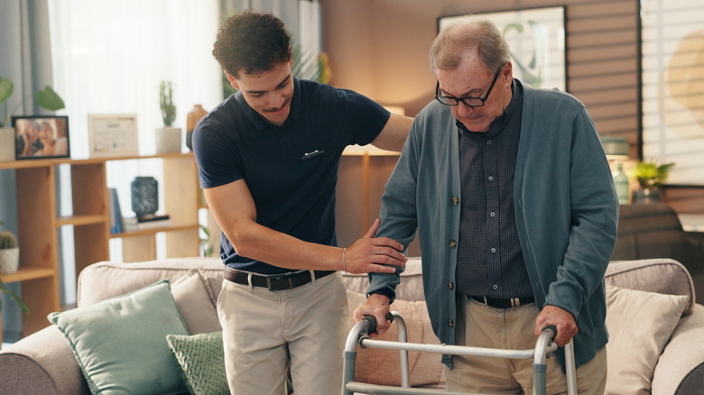 Caregiver helps old person