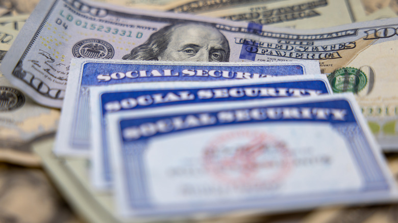 Money with Social Security cards