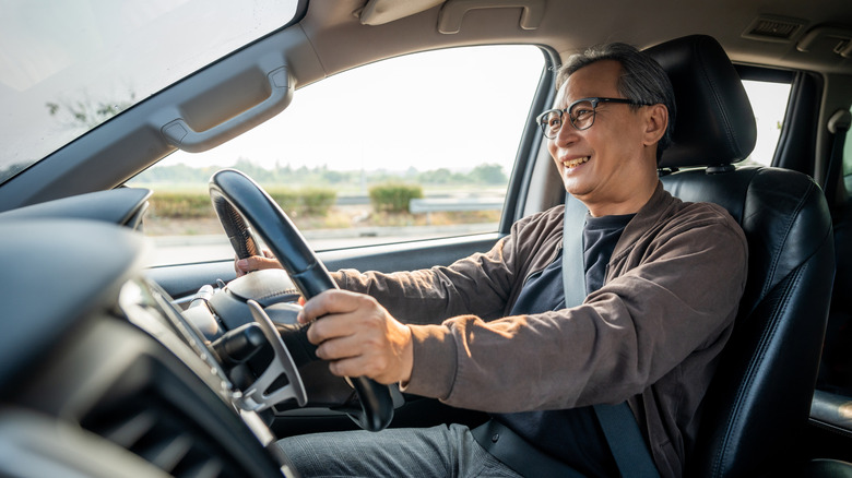 Older man behind the wheel of a car