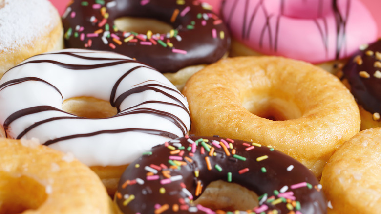 Close up on a variety of donuts, frosted and unfrosted