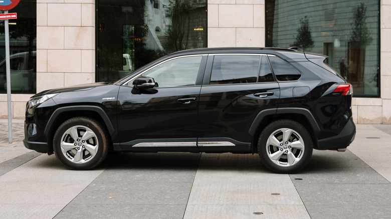 A black Toyota RAV4 parked on the street