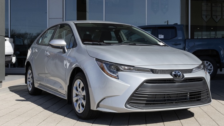 Gray Toyota Corolla parked outside a dealership