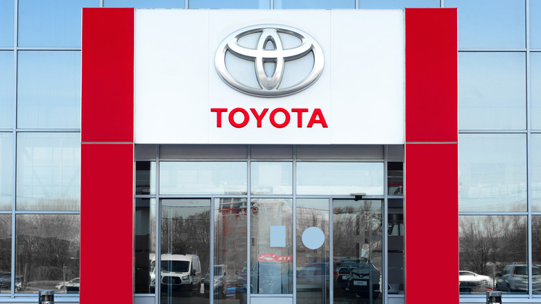 The Toyota logo outside a dealership.