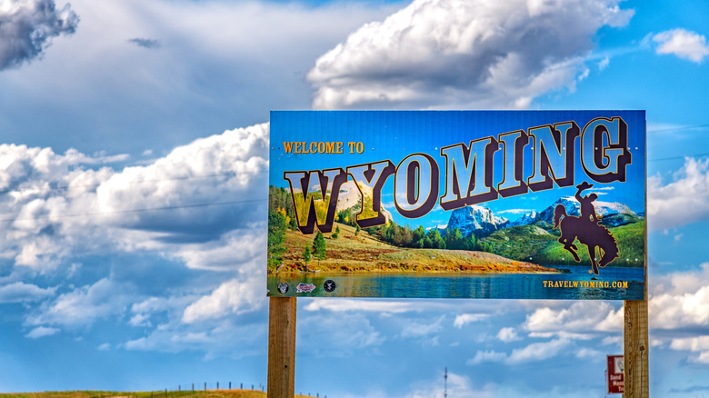 A welcome to Wyoming road sign on a sunny day
