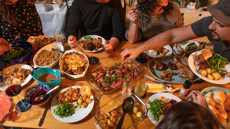 a group of people eating a meal together