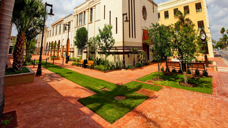 spanish style building with trees and sky
