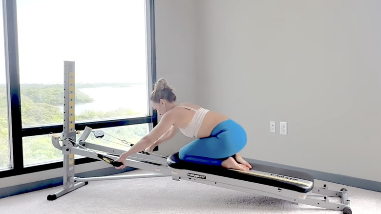 A Total Gym instructor mid-workout