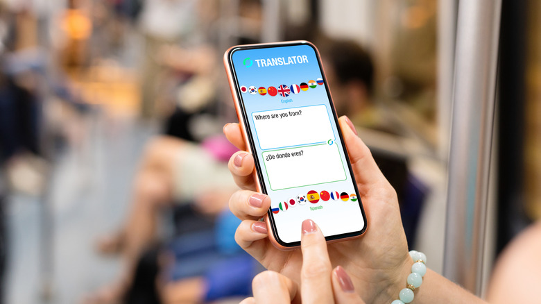 A person using a translator app on a smartphone
