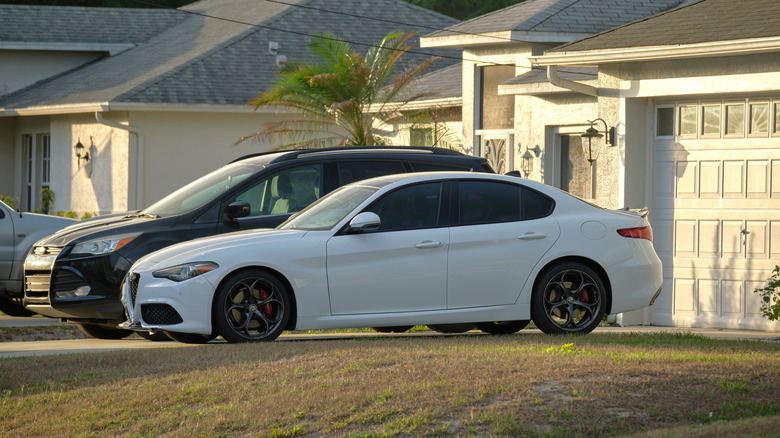 two cars parked on a driveway