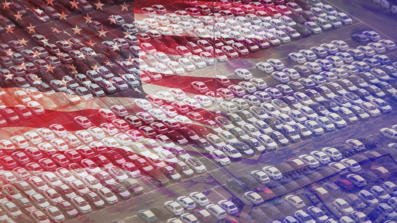 American flag super imposed over a parking lot of cars