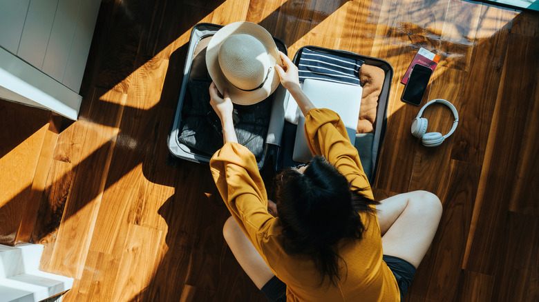 Person packing their suitcase