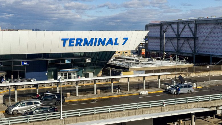 An exterior view of the Alaska Airlines Terminal 7 (aka T7) building on a sunny day at John F. Kennedy International Airport