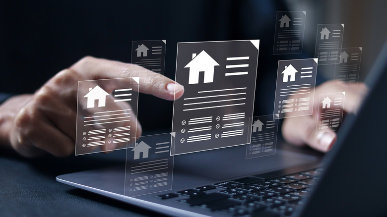 Real estate figures at a computer