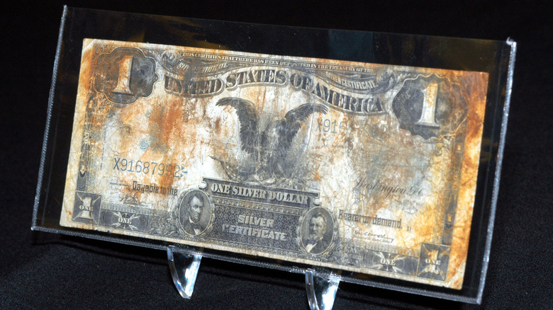 An 1899 'Black Eagle' Silver Certificate displayed in a clear case