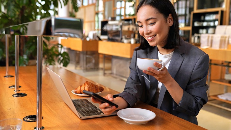 Person smiling while using smartphone