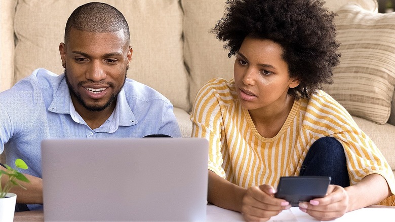 Couple looking at laptop together