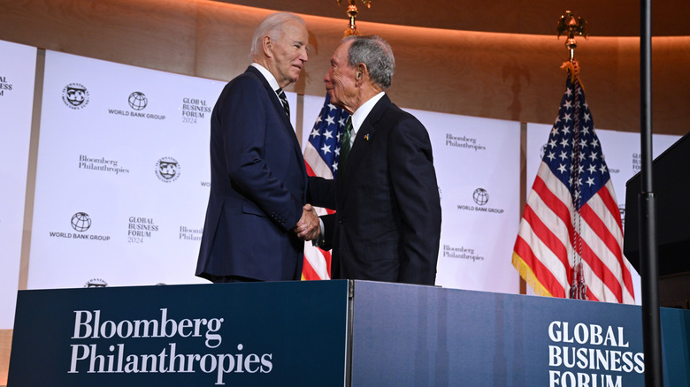 Joe Biden and Michael Bloomberg shaking hands on stage