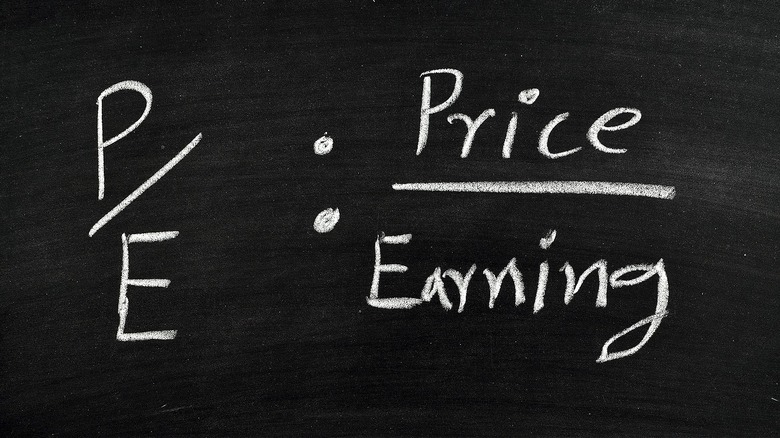 P/E ratio calculation on chalkboard