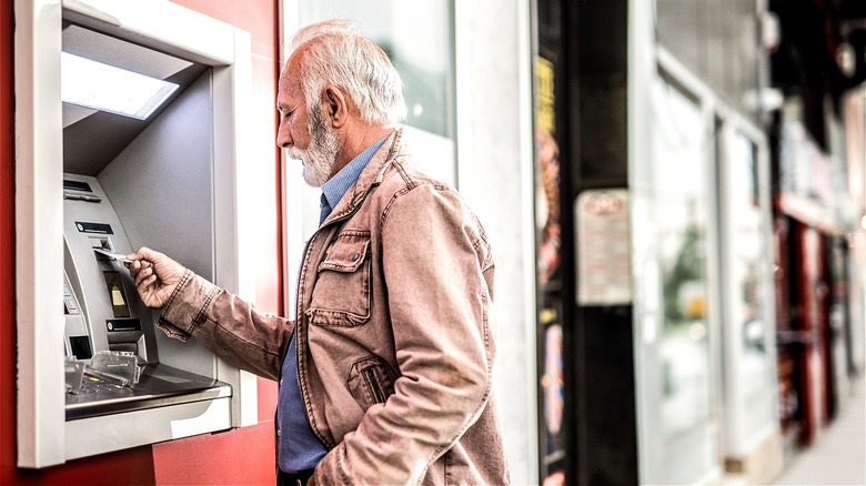 Senior using an outside ATM