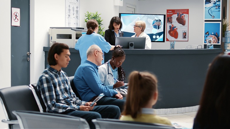 People in medical clinic lobby