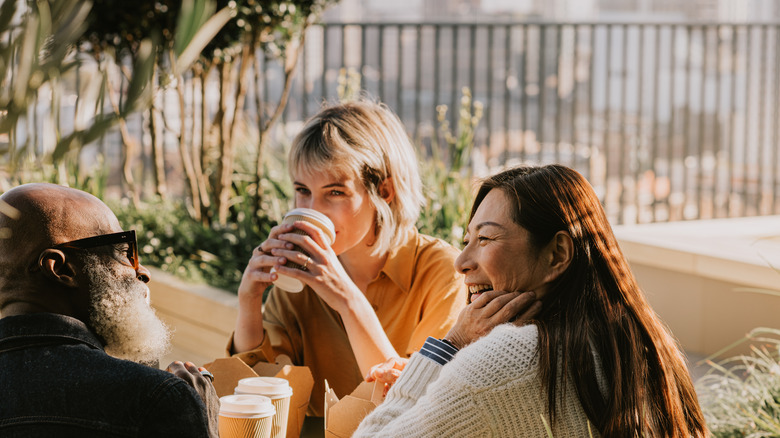 Happy looking group of friends at a restaurant table