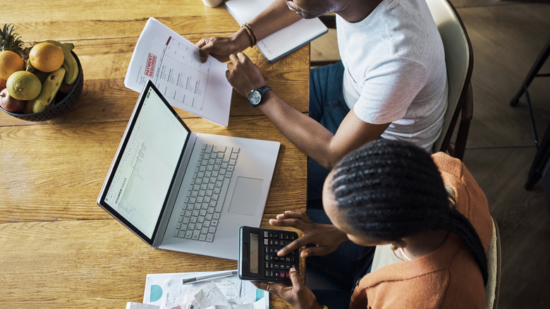 couple calculating interest rates