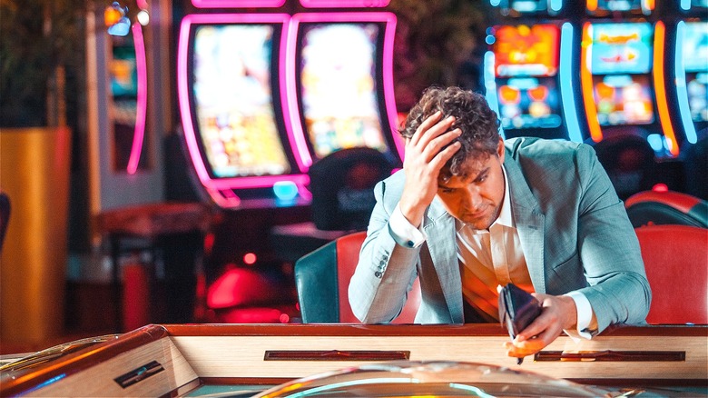 Person losing at casino table