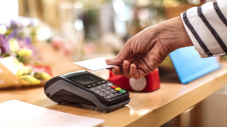 Person paying with credit card