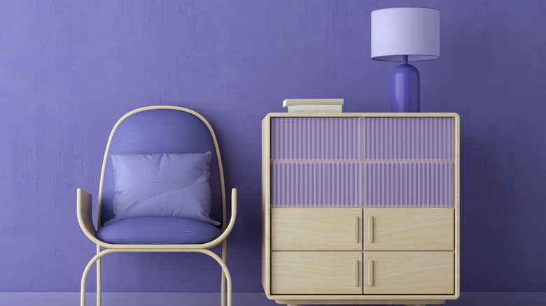 Purple furniture that matches similarly painted light purple wall
