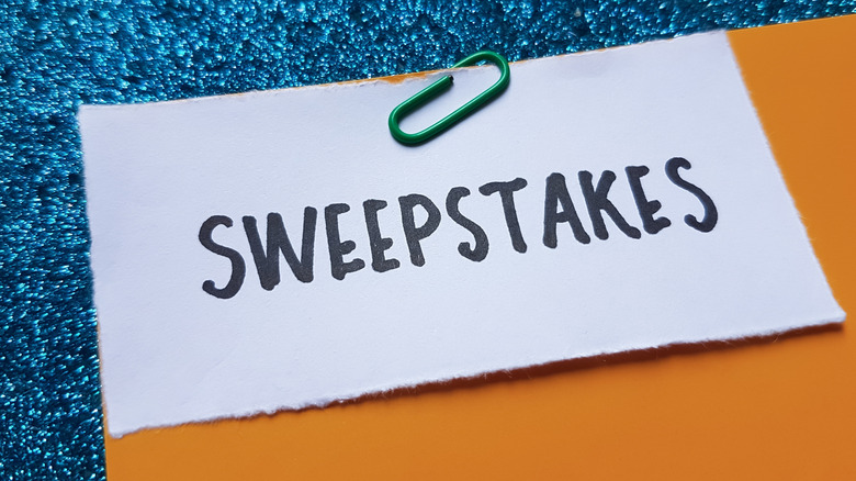 Sweepstakes writing on table background.